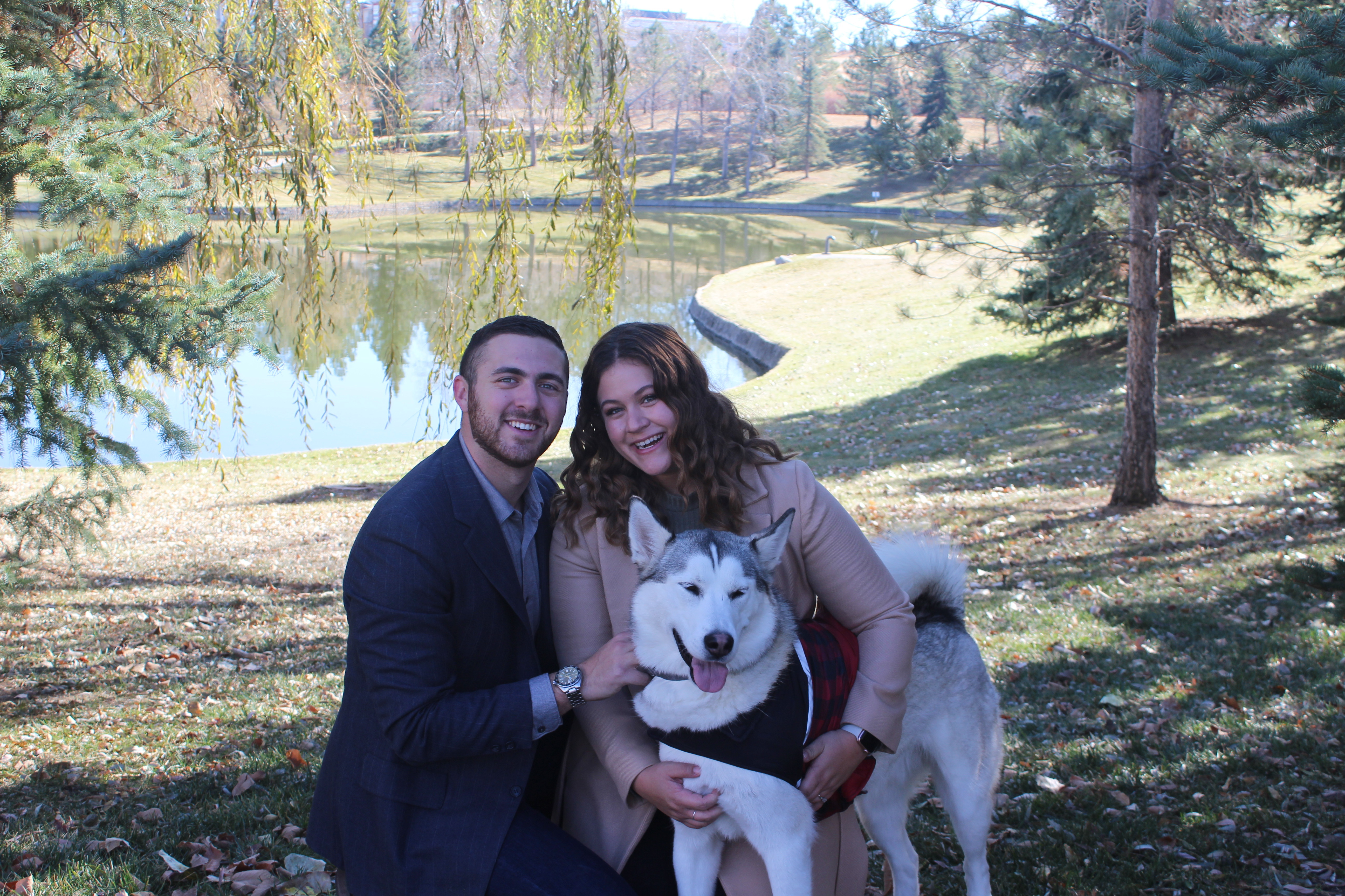 Jason and Kasey Weingarten, founders of Apollo Growth Strategies, with their husky Apollo
